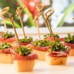 Melon & Prosciutto Skewers Over Greens Mix 2