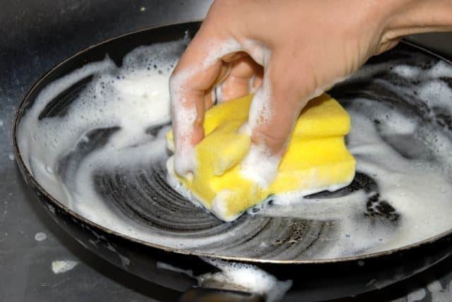 washing frying pan closeup