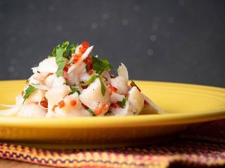 How to Make Ceviche - Step 9 image ceviche served on a yellow plate. inthekitch.net