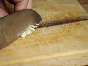 How to Chop Garlic - Step 5 image, chopping the garlic. inthekitch.net