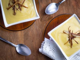 Leek & Potato Soup with Frizzled Leek Topping in fancy bowls. inthekitch.net