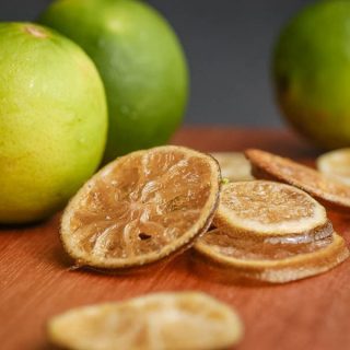 Sliced candied limes on wooden counter. inthekitch.net