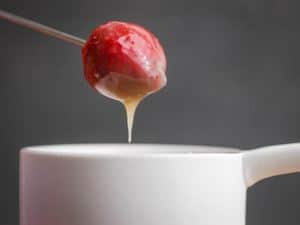 How to Make White Chocolate Ganache - Step 5 dipping strawberries - inthekitch.net
