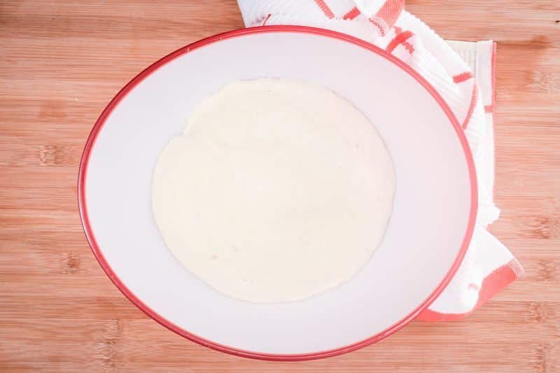 Pretzel roll dough in a bowl.