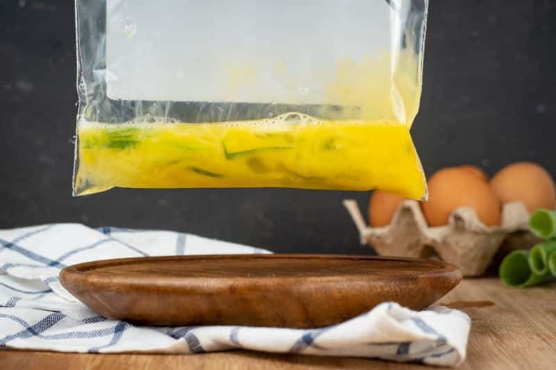 How to Sous Vide Eggs Step 2 Scrambled egg mixed in a plastic bag.