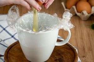 How to Sous Vide Eggs Step 4-2 Poached, adding egg to mug.