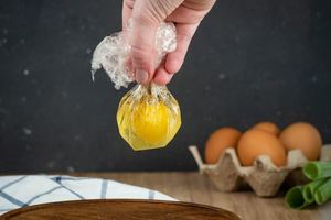 How to Sous Vide Eggs Step 6 Poached - placing egg in plastic bag.