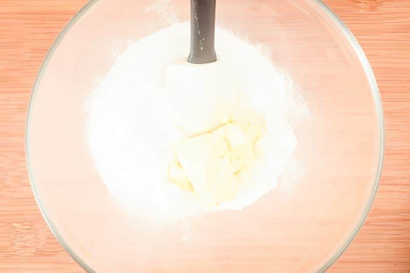 How to Make Buttercream Step 2 Mixing butter with powdered sugar.
