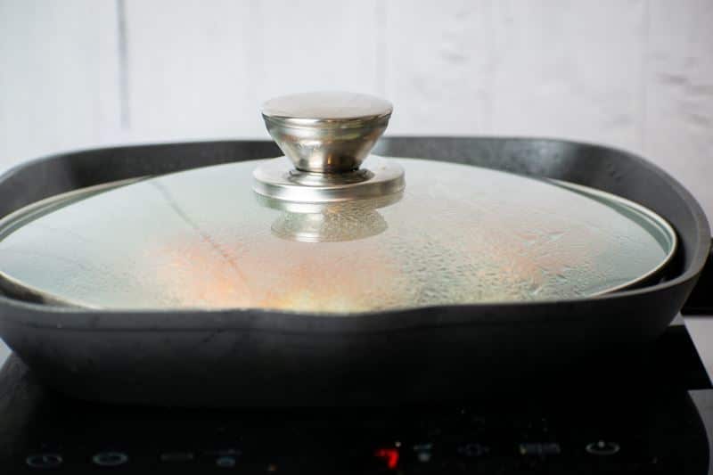 How to Cook Salmon With Skin Step 6 Pan on the stove, covered with a lid.