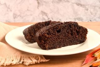 2 pieces of chocolate cake on a plate.