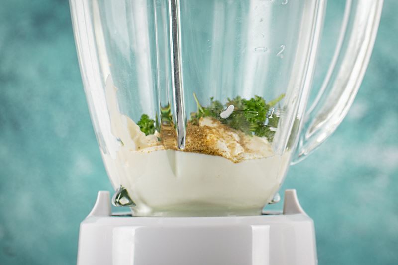 How to make chipotle sauce Step 2-4 Mayo, yogurt, cilantro and cumin in a blender.