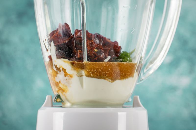 How to make chipotle sauce Step 2-6 Mayo, yogurt, cumin, cilantro and chipotle peppers in a blender.