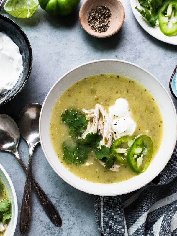 Roasted-Tomatillo-Chicken-Soup in a white soup bowl.