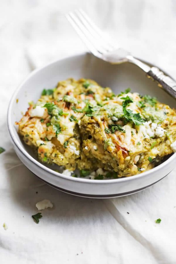 Chicken enchilada pie in a white bowl.