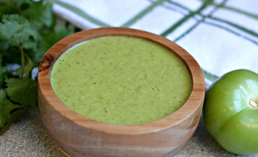 Authentic mexican salsa verde in a wooden serving bowl.