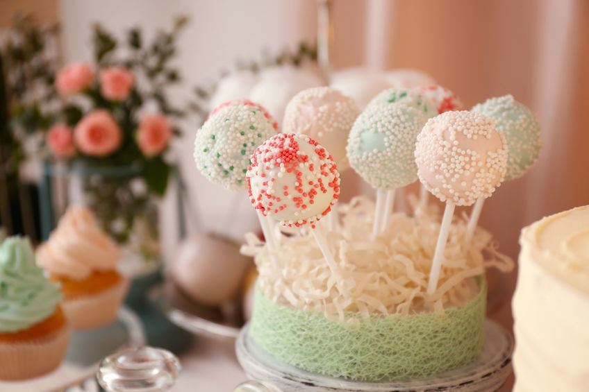 Cake pops in a loofah stand.