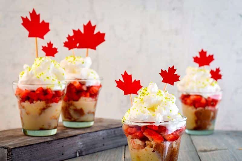 Canada Day Three Milks Cake with Strawberries in shot glasses.