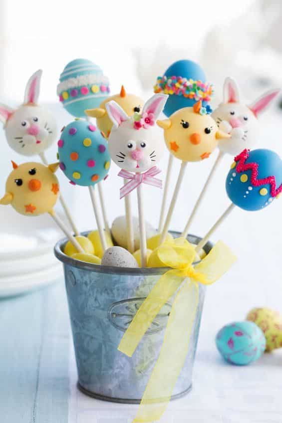 Cute easter cake pops in a small decorative pail.