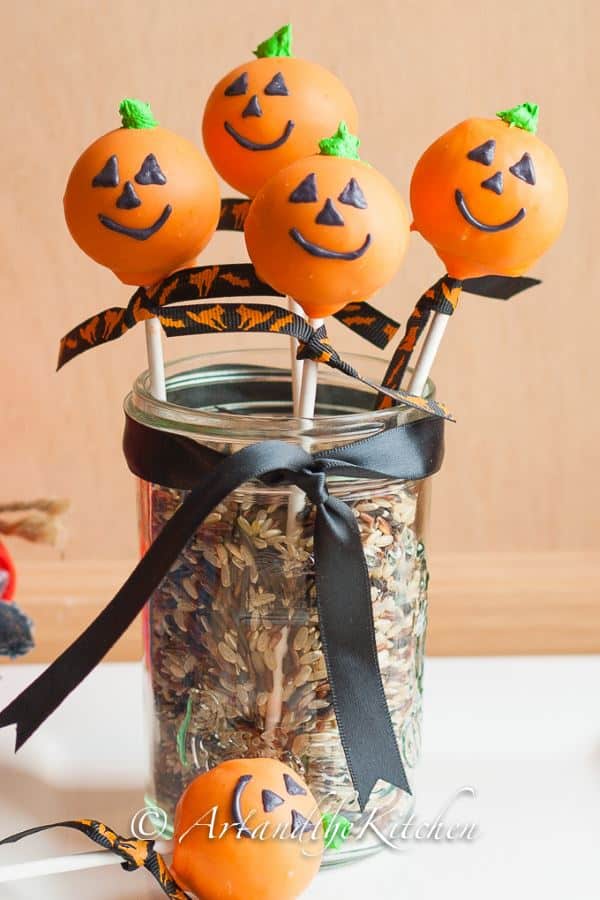 Jack o lantern cake pops in a jar.