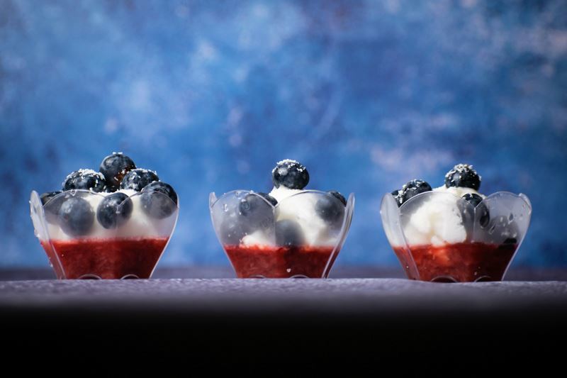 Red White & Blue Layered Fruit & Ice Cream treats in mini cups.