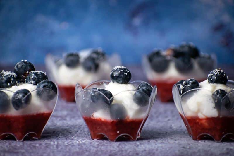 Red White & Blue Layered Fruit & Ice Cream Dessert 4 Red White & Blue Layered Fruit & Ice Cream treats in mini cups.