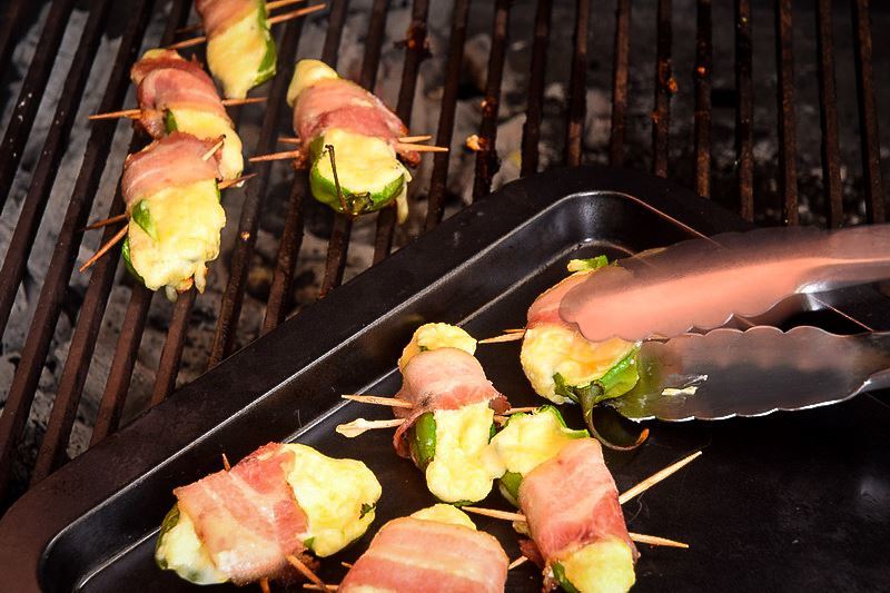 Jalapeno poppers on the BBQ charcoal grill.