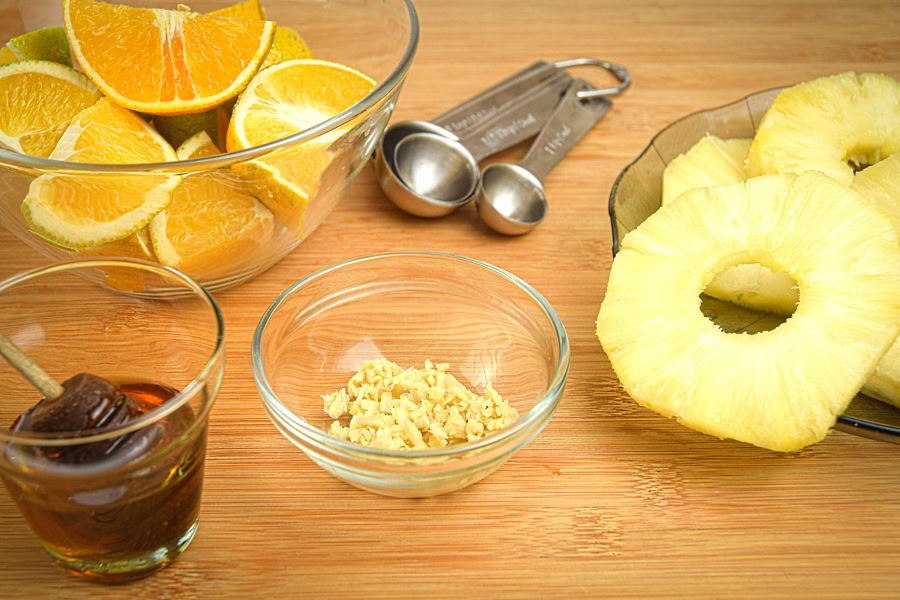 How to Grill Pineapple Slices_1 Prepped pineapple slices, ginger, honey and oranges.