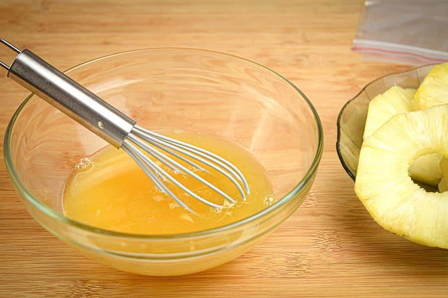How to Grill Pineapple Slices_4 Mixing pineapple marinade with a whisk.