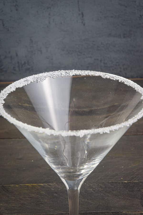 A martini glass rimmed with sugar.