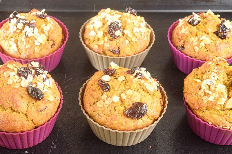 Pumpkin Muffins with cranberries in silicone muffin molds.