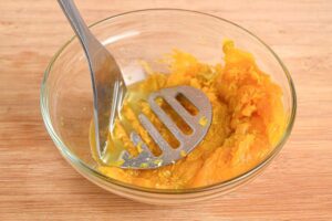 A bowl of fresh, raw pumpkin.