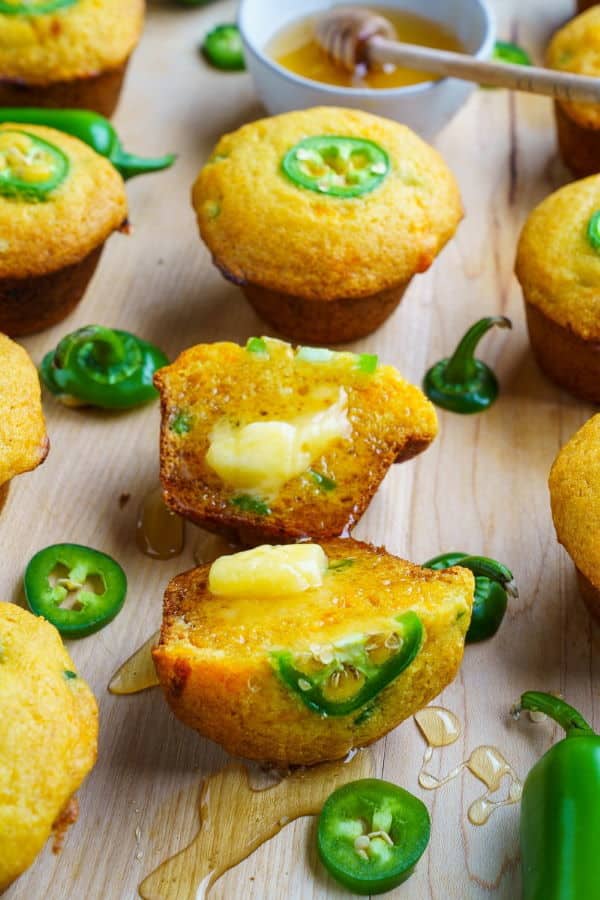 Jalapeno cornbread muffins on a wooden background.