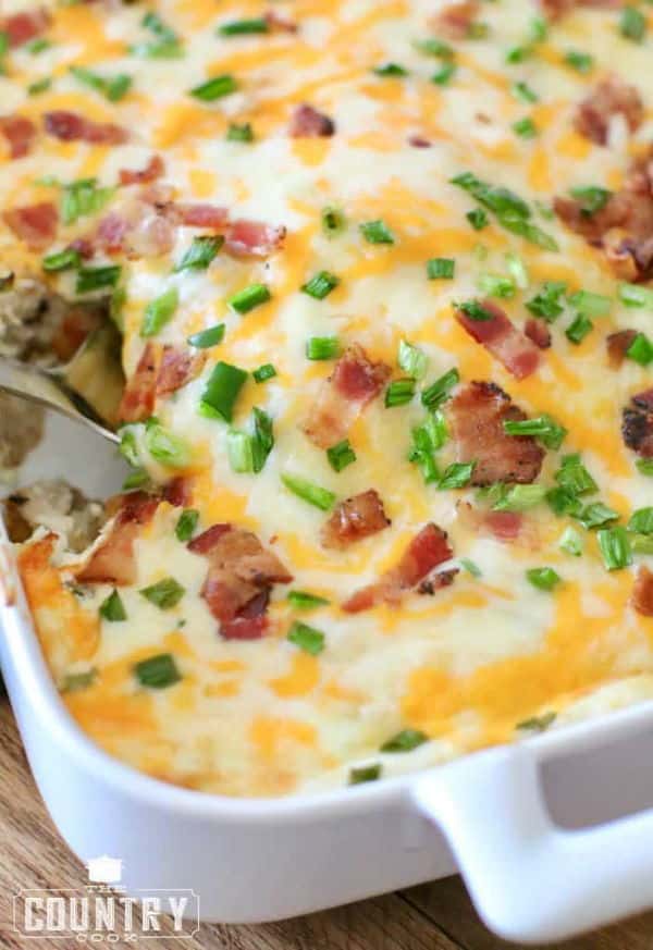 Jalapeno tater tot chicken casserole in a white casserole dish.