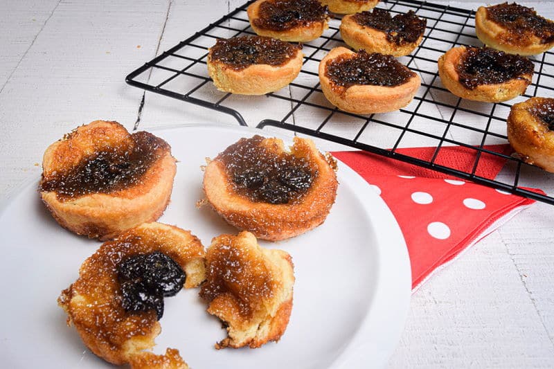 How to Make Butter Tarts_18 Butter tarts on a white plate and baking rack.