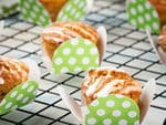 Gluten Free & Vegan Carrot Cupcakes on a wire rack and green polka dot packaging.