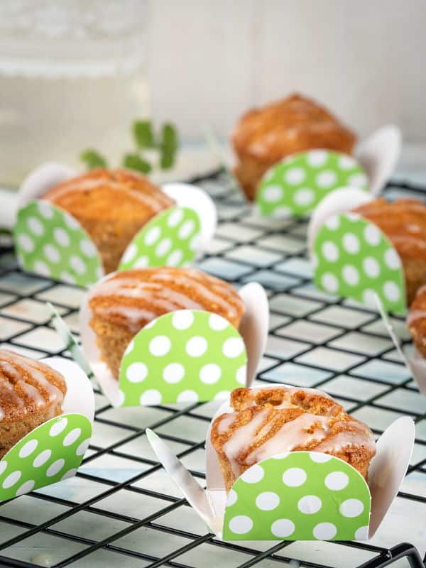 Gluten Free & Vegan Carrot Cupcakes on a wire rack and green polka dot packaging.