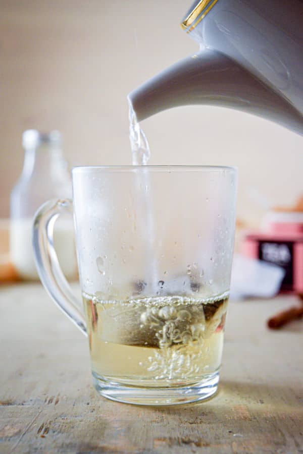Earl grey tea steeped in a clear glass mug.