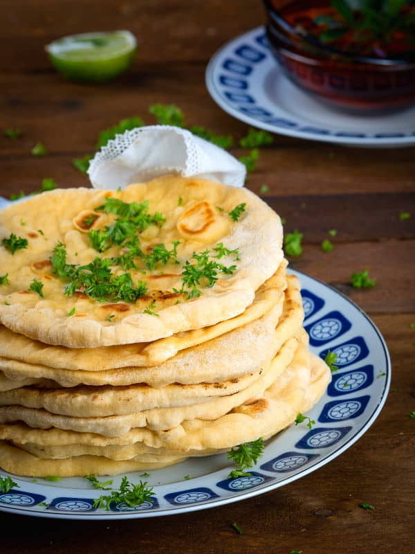 Pumpkin & Garlic Naan Bread 2 Pumpkin & Garlic Naan Bread piled on a plate.
