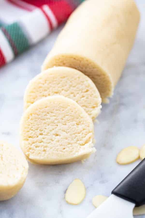 Sliced marzipan roll.