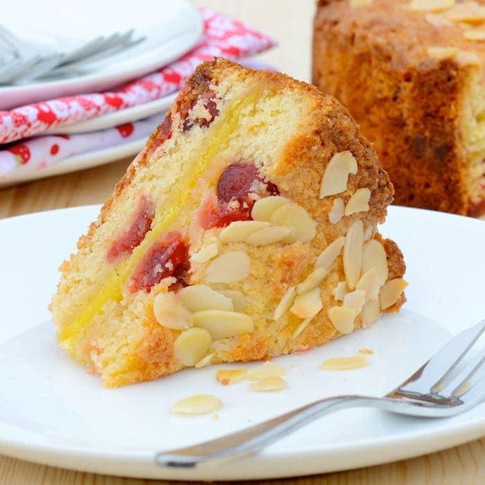 Cherry marzipan cake on a plate.