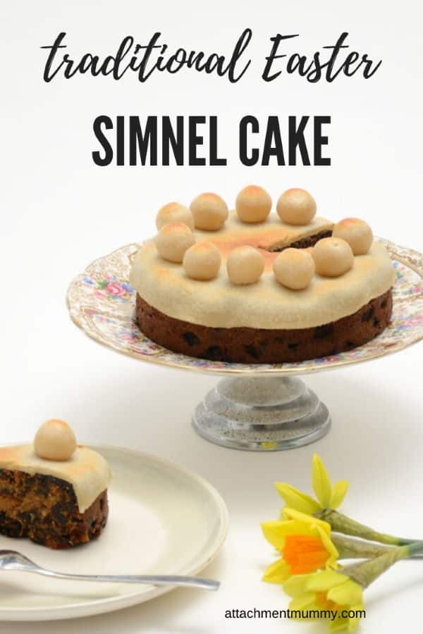 Simnel cake on a platter, white background.