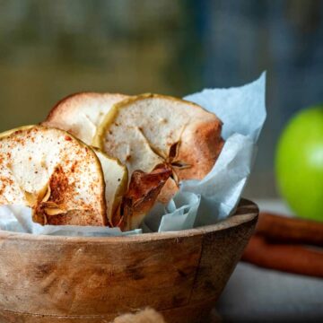 Cinnamon Apple Chips in a wooden bowl.