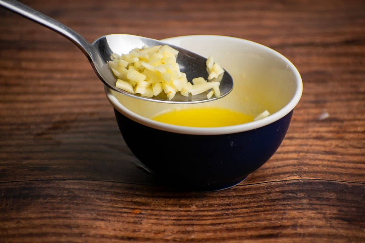 Garlic and melted butter in small bowl.
