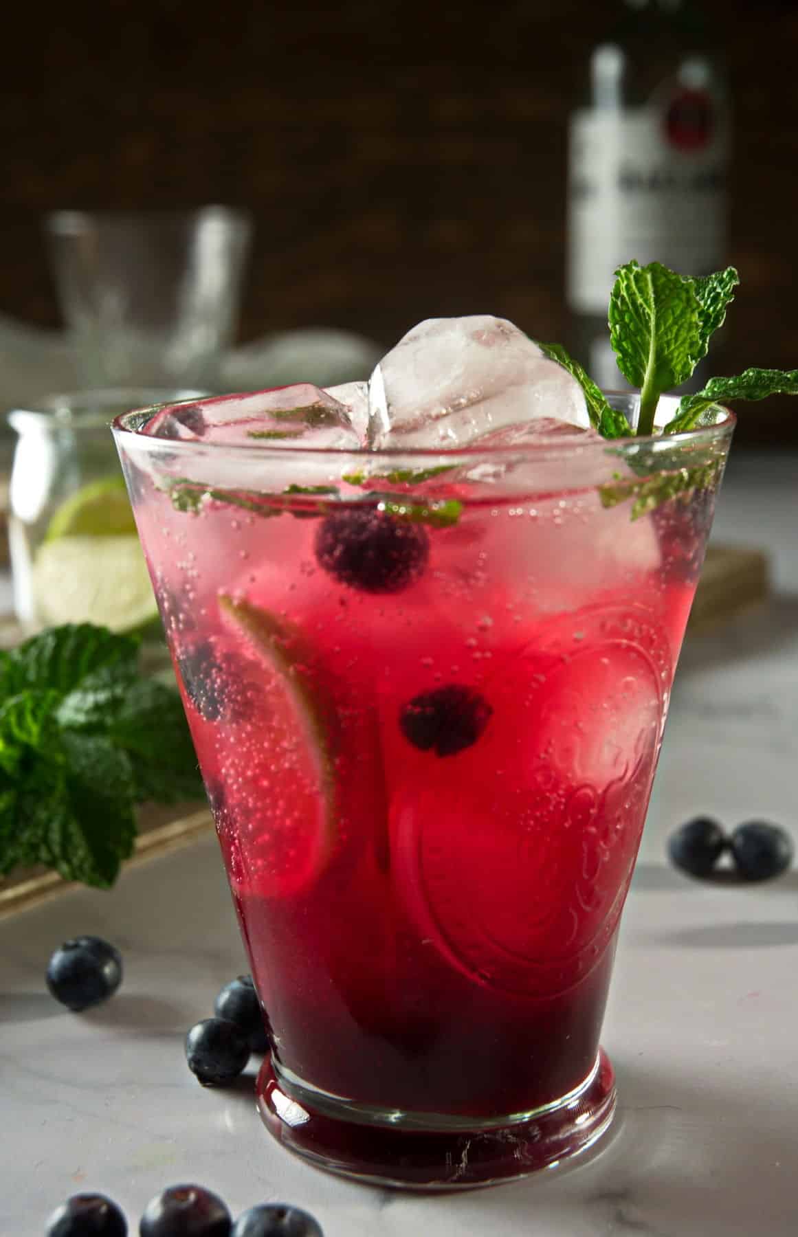 Blueberry mojito mocktail in a glass.