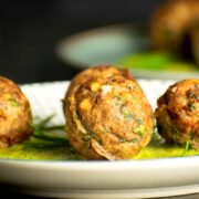 Mediterranean meatballs with dill sauce on plate.