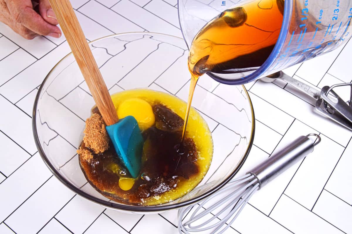 Butter tart wet ingredients in glass bowl.