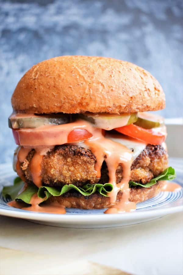 Chicken Fried Beef Burger on blue background.