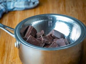 Chocolate bar pieces in double boiler.
