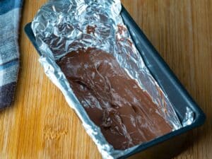 Chocolate in loaf pan with foil.