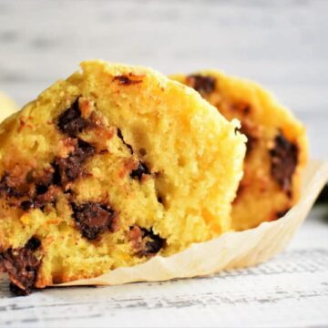 Chocolate Chip Orange Zest Muffins on white wooden background.